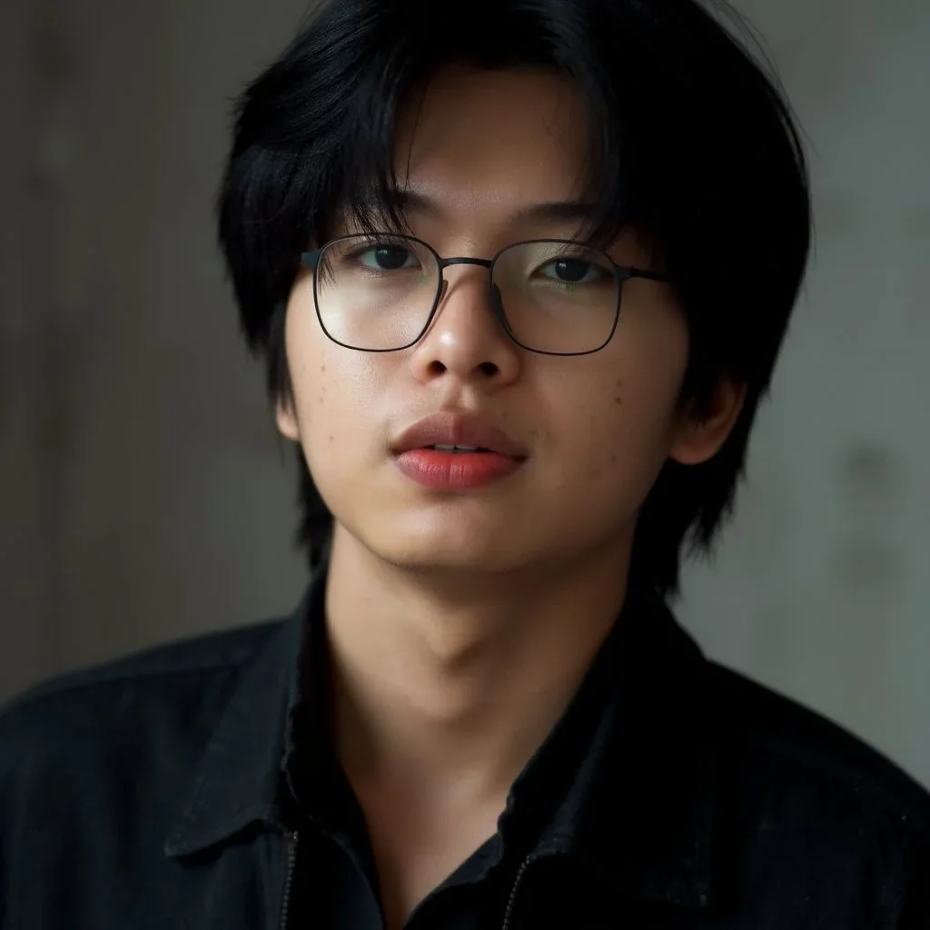 Existing Studio portrait example of a man wearing glasses